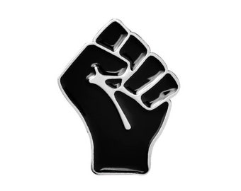 May include: Black raised fist enamel pin. The pin is silver with a black enamel fill.