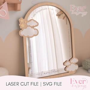 May include: A wooden arched mirror with the text "I am important" and "I am loved". The mirror has a cloud and star design. The text "I am Theo" is at the bottom. The words "LASER CUT FILE | SVG FILE" are at the bottom.