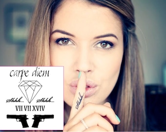 May include: A temporary tattoo sheet with a diamond, guns, and the text "carpe diem", "shhh...", and "VII VII VIII XIV".