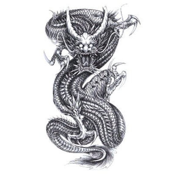 Microrealistic dragon tattoo on the inner forearm