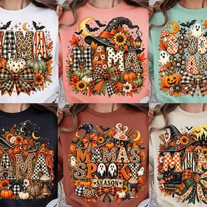 Puede incluir: Una colección de seis sudaderas de cuello redondo con estampados gráficos de otoño y Halloween. Cada prenda muestra la palabra MAMA o MAMA'S SPOOKY SEASON decorada con calabazas, sombreros de bruja, lazos a cuadros, girasoles y fantasmas.