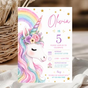 May include: A birthday invitation card featuring a watercolor unicorn with a rainbow mane, a floral crown, and a horn. The text reads Olivia is 5, Sunday August 25th, 2:00-4:00 PM, 185 Unicorn Street, Dallas, TX 75205, and RSVP to Emily by August 20th.