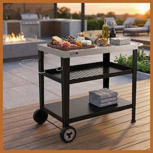 May include: A black and silver outdoor serving cart with three shelves and wheels. The top shelf holds a wooden cutting board with food, and bottles of oil and vinegar. The bottom shelf holds folded gray towels.