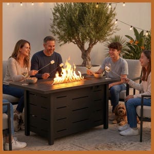 May include: A rectangular, dark gray outdoor fire pit table with a slatted top and horizontal cutouts on the sides. A family is gathered around the fire, roasting marshmallows. The scene is set outdoors with string lights and a tree.
