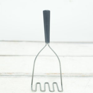 Vintage .  Potato Masher Vintage Black Plastic Handle Stainless Kitchen Tool Made in USA +