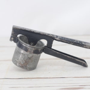 Vintage . Potato Ricer Potato Masher Vintage Black Kitchen Landers Frary Clark USA