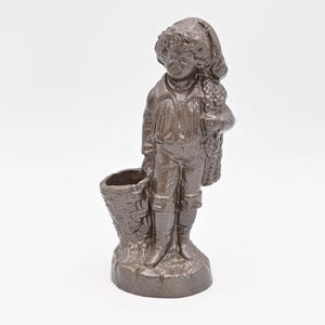 Vintage . Collectible Boy Figurine Boy With Wicker Basket and Blanket, Painted Bronze