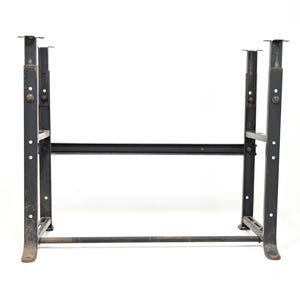 May include: A black metal table base frame featuring four vertical legs with adjustable height mechanisms, connected by horizontal support bars. The structure includes multiple pre-drilled holes along the vertical posts and flat mounting plates.