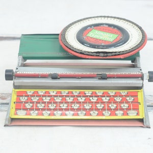 Vintage Typewriter Practical Simplex No 300 Child&#39;s Typewriter Red and Yellow Tin Metal