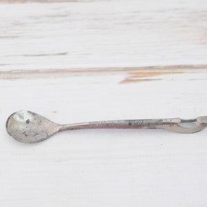 Vintage . Metal Cocktail Stirrer Bottle Opener Advertising Howard Co.