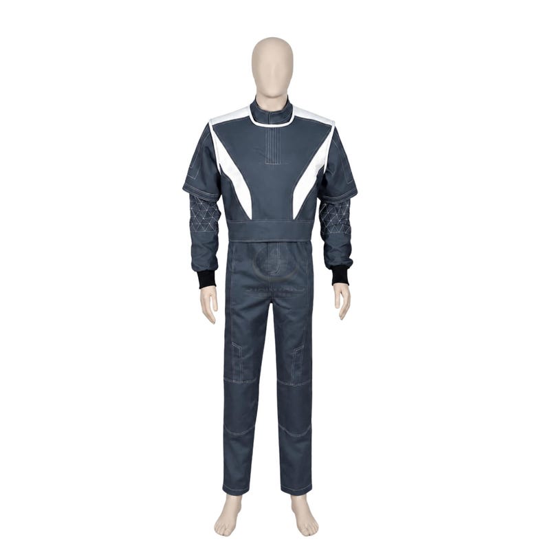 May include: A dark gray jumpsuit featuring a high collar, white angular shoulder panels, and short sleeves layered over long sleeves with a geometric triangular pattern. The garment includes black ribbed cuffs at the wrists and a fitted waistline.