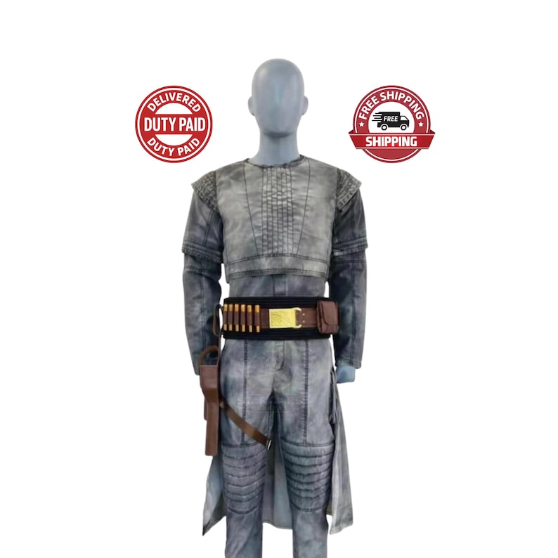 May include: A gray costume with a weathered appearance, featuring a cropped top, long sleeves, and matching pants. A brown belt with bullet casings and a holster with a toy gun are included. The costume is displayed on a mannequin.