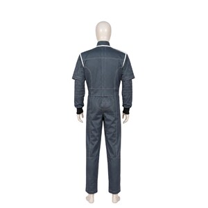 May include: A dark gray jumpsuit featuring a high collar, long sleeves with ribbed black cuffs, and white piping accents along the shoulders and back. The garment has a structured fit with visible stitching details throughout the torso and legs.