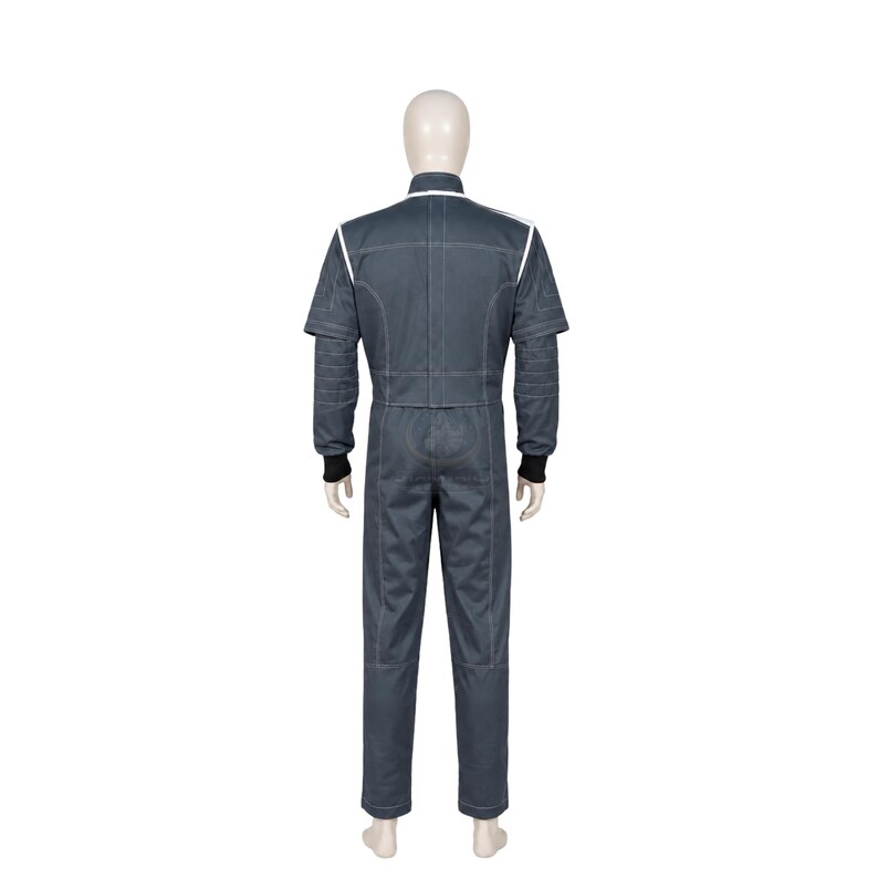 May include: A dark gray jumpsuit featuring a high collar, long sleeves with ribbed black cuffs, and white piping accents along the shoulders and back. The garment has a structured fit with visible stitching details throughout the torso and legs.