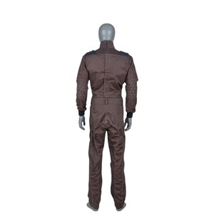 May include: Brown jumpsuit with black shoulder and sleeve accents. The jumpsuit features a high collar and a zip closure. Decorative stitching adorns the sleeves. The garment is displayed on a mannequin.