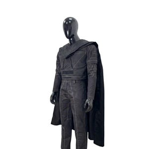 May include: A black long-sleeved top and matching trousers set featuring white contrast stitching, geometric patterns on the sleeves, and a structured shoulder overlay. The outfit is completed by a long, flowing black cape worn over the shoulders.