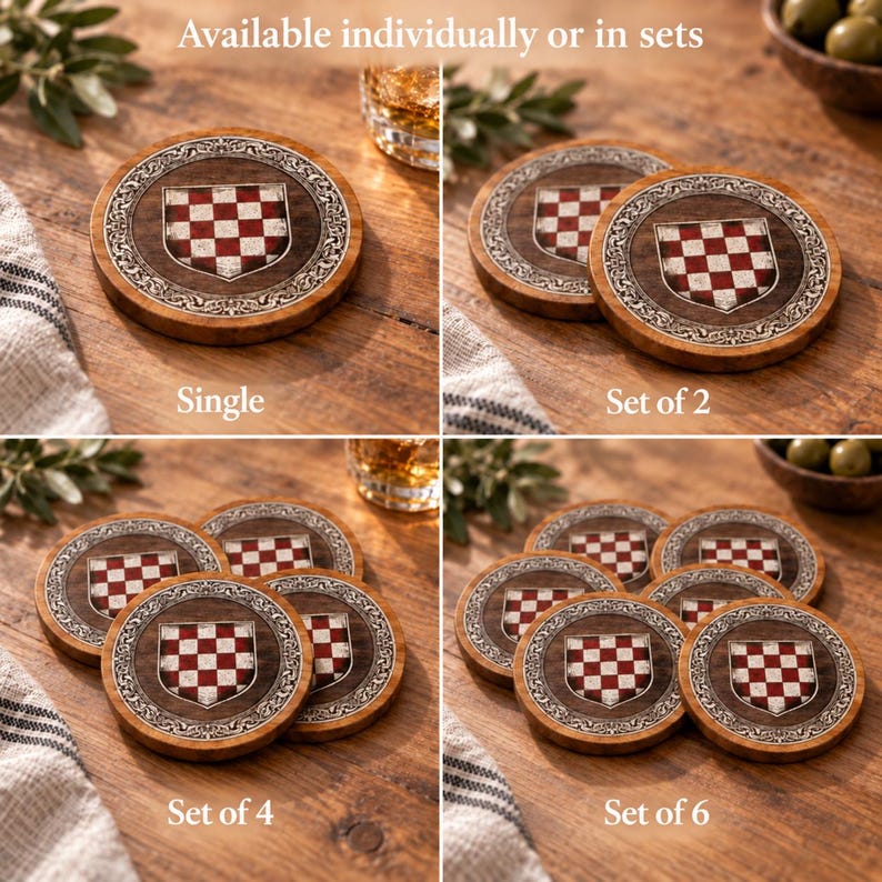 May include: Round wooden coasters featuring a central shield with a red and white checkered pattern, surrounded by an ornate silver-toned border. The coasters are displayed in groups of one, two, four, and six, with the text Available individually or in sets.