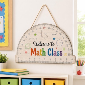 May include: A semi-circular wooden wall sign shaped like a protractor with a jute rope hanger. The off-white surface features black degree markings, a ruler scale, math formulas, geometric shapes, and the text Welcome to Math Class in colors.
