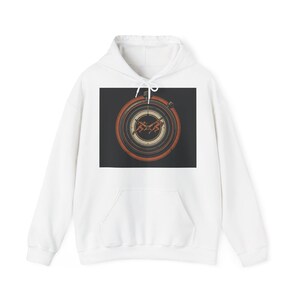 May include: White hoodie featuring a graphic print. The print is a circular design with orange and brown concentric circles, and two running figures. The graphic is set against a black background.