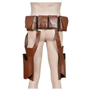 May include: Brown leather utility belt with multiple pouches and leg straps. The belt features four rectangular pouches and two additional pockets attached to the leg straps. The leather has a smooth finish and is designed to be worn around the waist and legs.