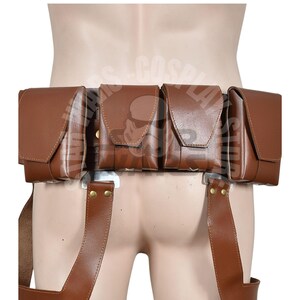 May include: A brown leather utility belt with four rectangular pouches and suspender straps. The pouches have flap closures and are attached to a silver-coloured metal belt. The suspender straps are secured with brass-coloured rivets.
