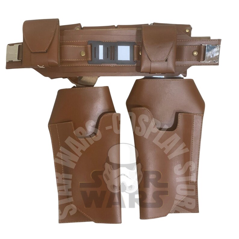 May include: A brown leather belt and leg armour set. The belt has two pouches, a rectangular buckle, and a central panel. The leg armour features a curved design. This set is likely for cosplay or costume use.
