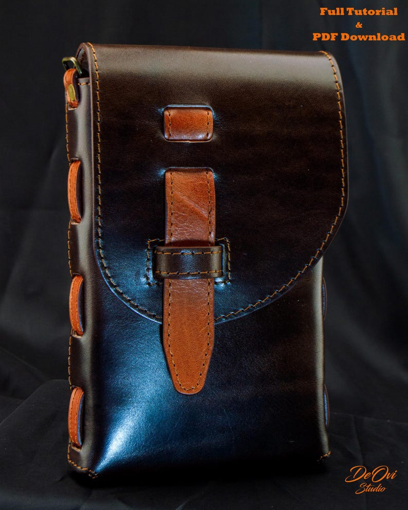 May include: A dark brown leather pouch with a smooth finish, featuring a lighter tan leather strap closure and side lacing. The bag has a flap top, visible stitching, and metal hardware at the top corners. Text reads Full Tutorial & PDF Download.