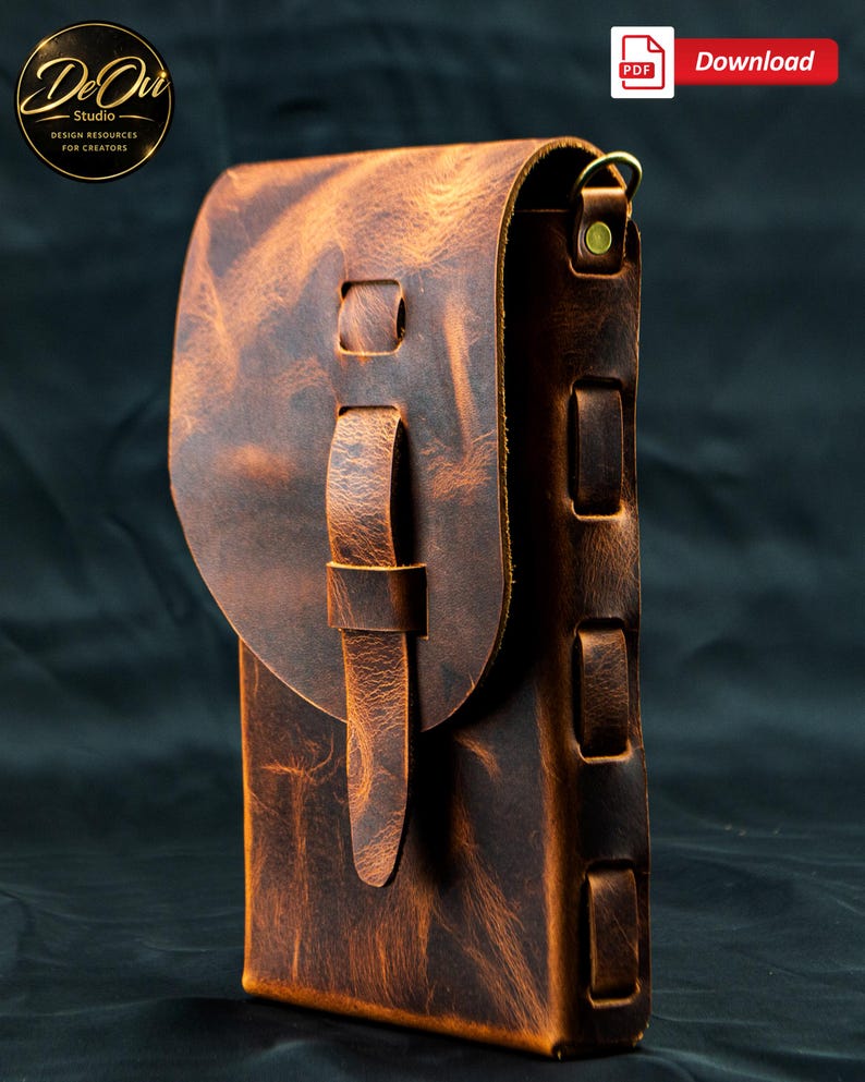 May include: A vertical brown leather pouch with a distressed texture, featuring a rounded flap closure secured by a leather strap loop. The side panel displays a series of rectangular cutouts with woven leather detailing and a brass metal D-ring.