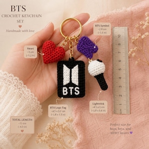May include: A handmade crochet keychain set with a red heart, a purple symbol, a lightstick, and a black tag with "BTS" on it. The total length is 11 cm. The keychain is perfect for bags and keys.