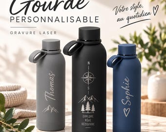Peut inclure: Trois gourdes au fini mat en gris, noir et bleu. La gourde grise porte le prénom Thomas et un motif de montagne. La noire affiche une boussole, des montagnes, des sapins et le texte EXPLORE RÊVE DÉCOUVRE. La bleue porte le prénom Sophie et un cœur.