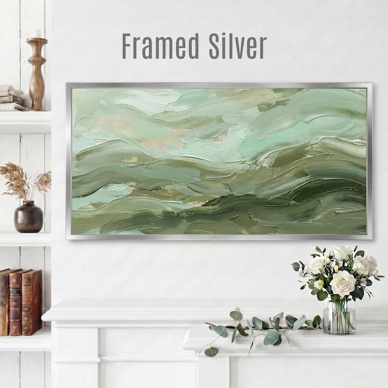 May include: A framed abstract painting with a silver frame. The artwork features layered brushstrokes in shades of green, creating a textured, wave-like effect. The text "Framed Silver" is at the top of the image.
