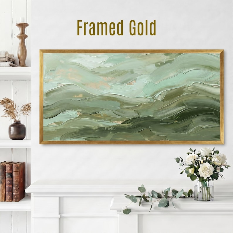 May include: A framed abstract painting with a gold frame. The artwork features a textured, layered design in shades of green and beige, evoking a sense of flowing water or landscapes. The text "Framed Gold" is displayed above the painting.