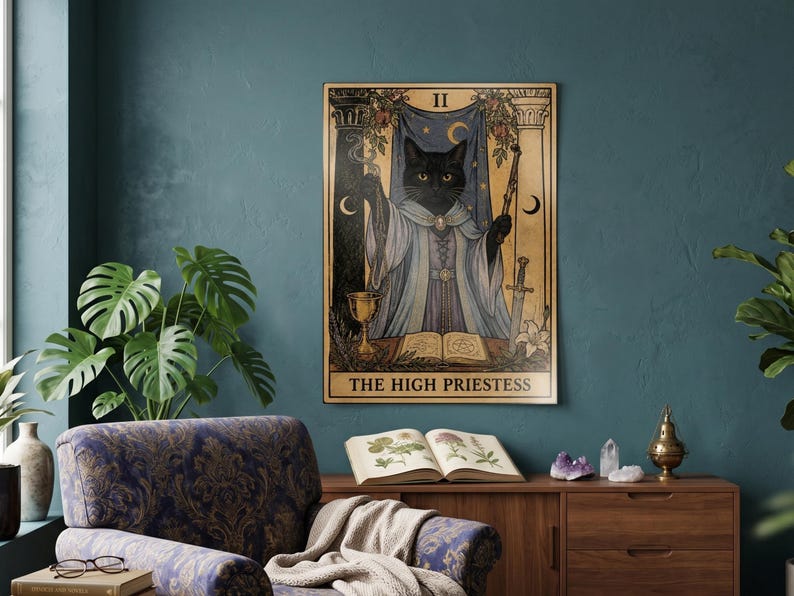 May include: A rectangular wall art print featuring a black cat dressed as The High Priestess tarot card. The illustration includes a blue curtain, pillars, a golden chalice, a sword, and an open book. The text THE HIGH PRIESTESS is at the bottom.