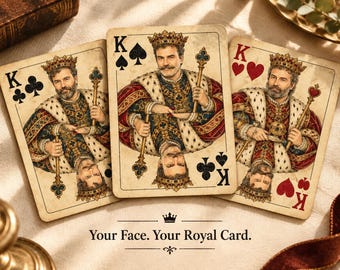 May include: Three playing cards featuring a king illustration with a beard and crown, wearing a red and blue robe with ermine trim. The cards display the letters K and suit symbols for clubs, spades, and hearts. Text reads: Your Face. Your Royal Card.