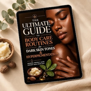 May include: A digital tablet displaying a guide titled The Ultimate Guide to Body Care Routines for Dark Skin Tones & Hyperpigmentation. The screen features a person with dark skin, a wooden bowl of shea butter, green leaves, and oil droplets.