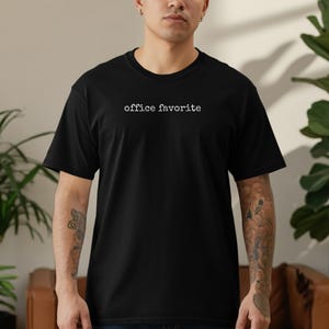 Black t-shirt with "office favorite" printed in white text.
