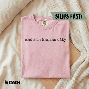 Blossom pink t-shirt with "made in kansas city" text.