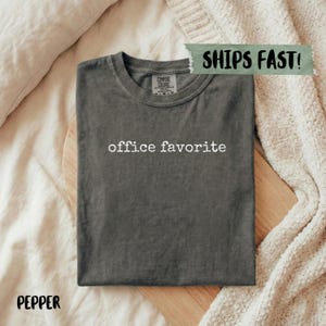 Comfort Colors dark grey t-shirt with "office favorite" printed in white text.