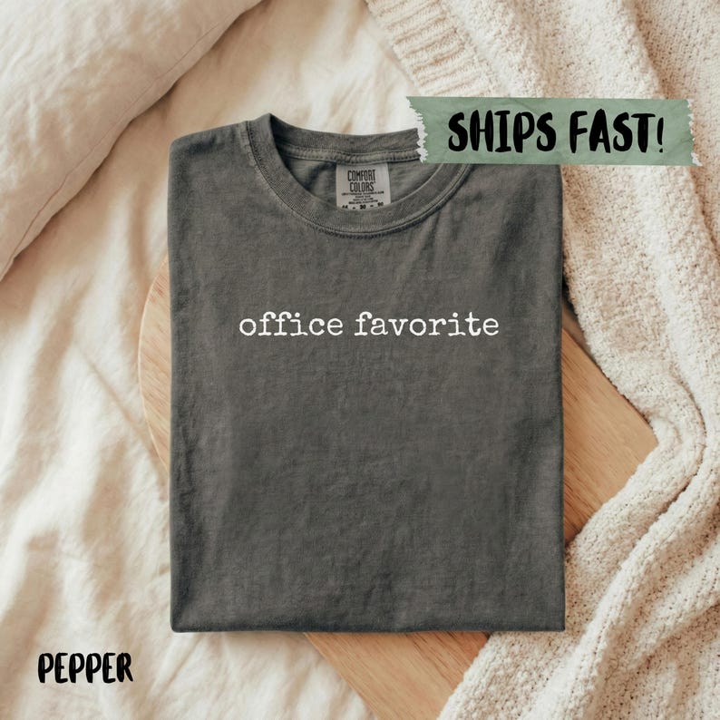 Comfort Colors dark grey t-shirt with "office favorite" printed in white text.