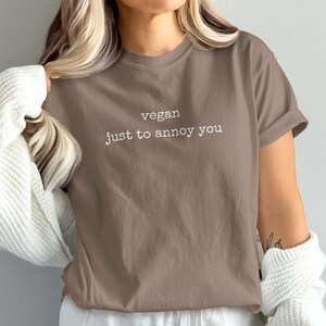 Brown t-shirt with white text "vegan just to annoy you".