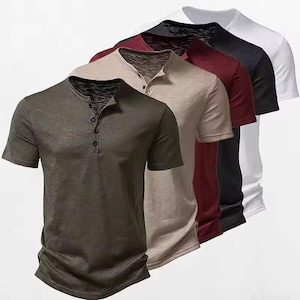 May include: A collection of five short-sleeved henley shirts arranged in a row, featuring a buttoned placket at the neckline. The shirts are presented in a gradient of colors including olive green, beige, maroon, black, and white, all with a textured fabric finish.