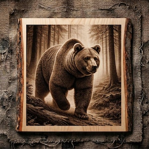 May include: A square wooden plaque with a live edge, featuring a sepia-toned illustration of a large brown bear walking through a dense forest. The artwork displays detailed fur textures and tall pine trees in the background, set on a light wood.