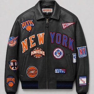 May include: A black leather jacket featuring a full-length front zipper, a collar, and ribbed cuffs. The jacket is decorated with various embroidered patches, including New York Knicks basketball logos, Kith branding, and the text New York.
