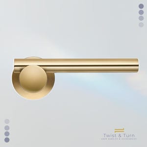 May include: A gold-colored door handle with a cylindrical bar and a circular base. The handle has a modern design and is set against a light background. The text "Twist & Turn DOOR HANDLES & ACCESSORIES" is at the bottom.