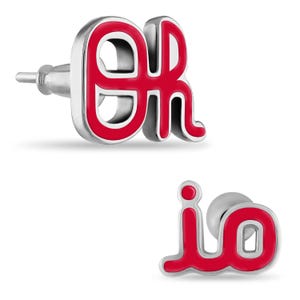 May include: A pair of silver-toned stud earrings. Each earring features a red enamel design. One earring has the letters "ER" and the other has the letters "io". The earrings are set against a white background.