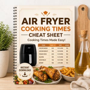 Könnte beinhalten: Ein spiralgebundenes Kochbuch mit dem Titel "Air Fryer Cooking Times Cheat Sheet". Das Cover zeigt einen schwarzen Airfryer, eine Tabelle mit Garzeiten und Bilder von gekochten Speisen. Der Text "Instant Download" ist ebenfalls sichtbar.
