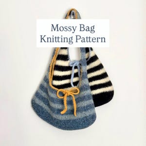 May include: A handmade knitted bag with blue and white stripes, featuring a mustard-colored drawstring and bow. The bag is hanging against a white background. The text "Mossy Bag Knitting Pattern" is displayed on a white rectangle.