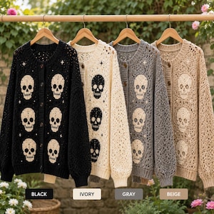 May include: Four long-sleeved button-down cardigans in black, ivory, gray, and beige. Each knit sweater features a repeating skull pattern and small star accents. The garments have a textured, open-weave design with ribbed cuffs and necklines.