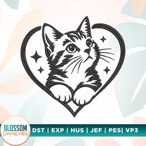 May include: A black and white machine embroidery design featuring a tabby kitten positioned inside a heart outline. The kitten has visible stripes, whiskers, and large eyes, surrounded by four small four-pointed stars. Text reads Blossom CanvasCrafts.