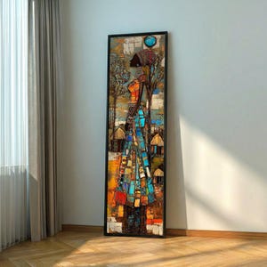 May include: A framed vertical artwork depicting a stylized figure in colorful mosaic-like patterns. The figure is adorned with a head covering and a long garment, set against a backdrop of trees and huts. The color palette includes blues, oranges, and browns.